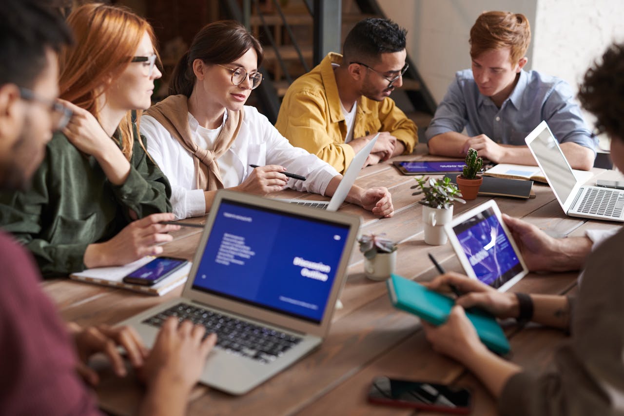 legal professionals around a table with devices