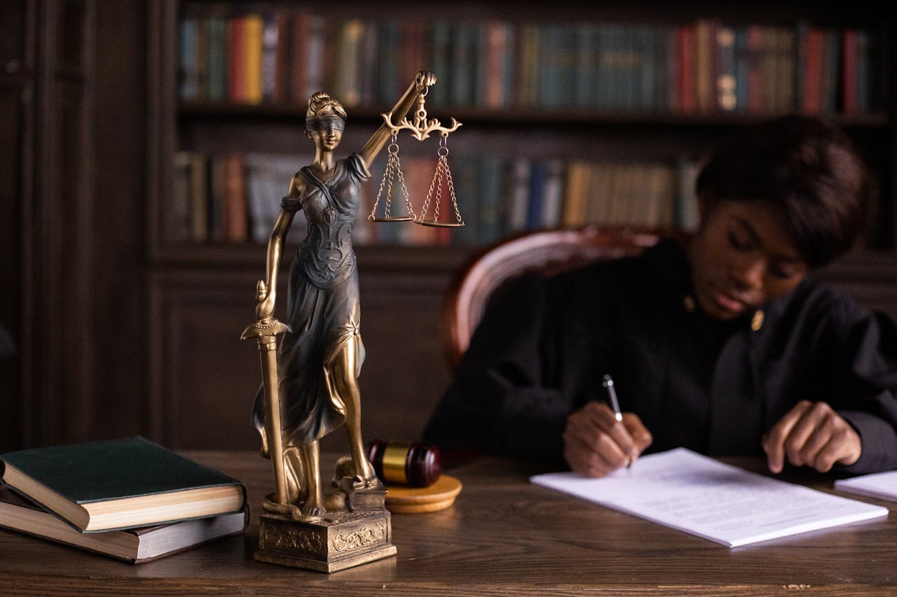 lady justice on table with judge